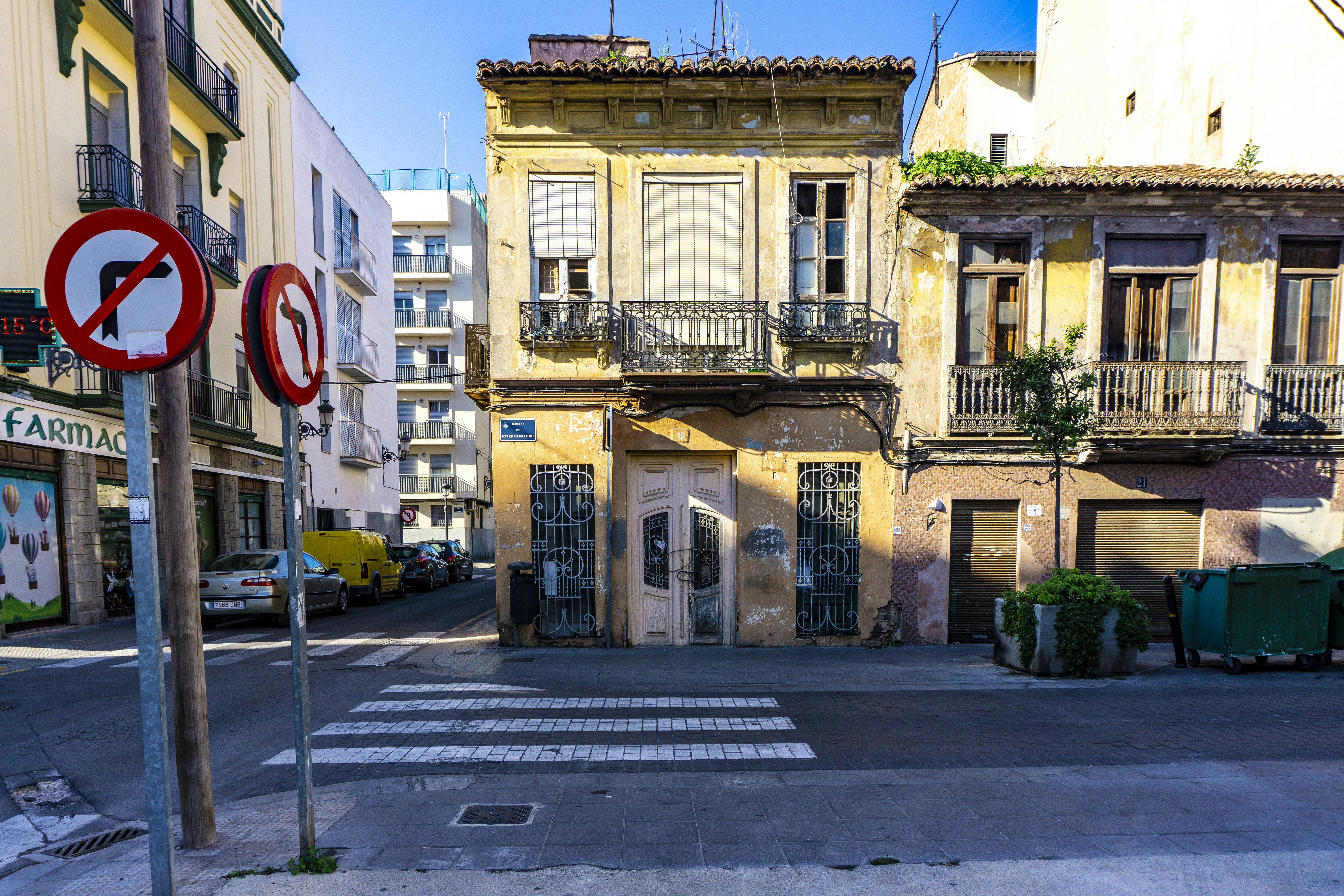 two no left and right turns road signage beside brown building